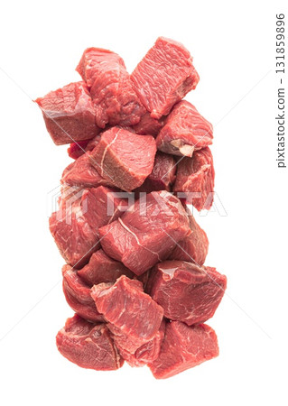 Fresh, cut pieces of meat are isolated against a white background, showcasing their quality and texture for culinary use. Ideal for promoting fresh meat products. 131859896