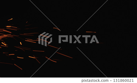 sparks and embers from campfire flying over black background sparks and embers from campfire flying over black background 131860021