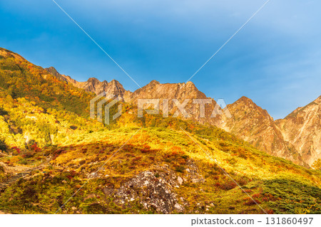 Early morning hike through autumn leaves at Happoyama and the sunrise in the Northern Alps 131860497