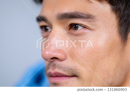 Young Korean man in modern clinic receiving cosmetic nose filler injection by professional doctor Young Korean man in modern clinic receiving cosmetic nose filler injection by professional doctor 131860903