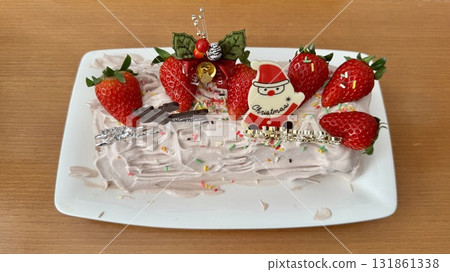 A Christmas cake decorated by a child in the style of Buche de Noel A Christmas cake decorated by a child in the style of Buche de Noel 131861338