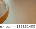 The edge of the low table gives off a warm wooden feel 131861455