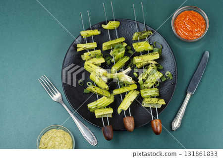 Vegetable celery skewers arrayed on a platter. 131861833