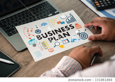 Business plan sheet on office desk with laptop and calculator, featuring strategy target, analytics, checklist, growth ideal for startup planning, corporate strategy, marketing. 131861868