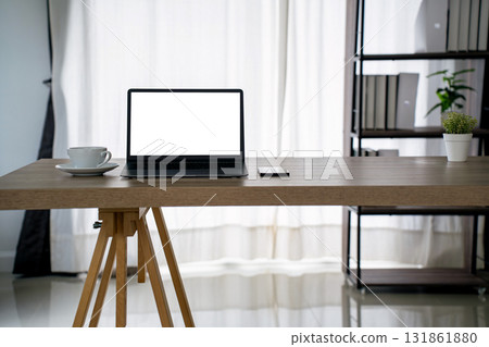 laptop mockup Minimal productivity concept. Clean home office desk, blank screen for UI preview, coffee cup laptop mockup Minimal productivity concept. Clean home office desk, blank screen for UI preview, coffee cup 131861880