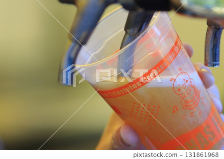 Beer poured from the tap, craft beer, draft beer 131861968
