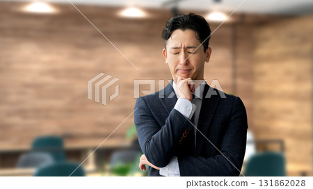 A male businessman thinking 131862028