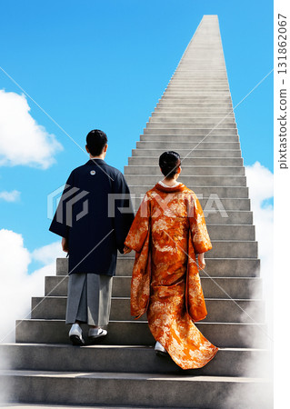 Bride and groom climbing the stairs to the sky 131862067