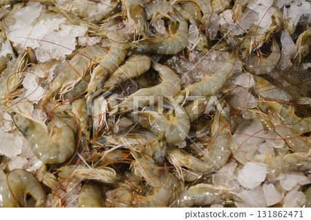 Fresh shrimp displayed on ice at a local market early in the morning, highlighting the day s catch from nearby waters 131862471