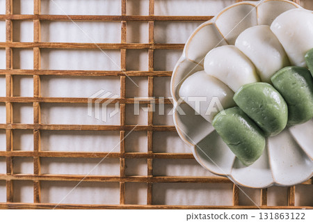 jeolpyeon, korean style Patterned Rice Cake, Short grain rice powder sieved and pressed into a rice cake mold. Unlike other rice cakes made with non-glutinous rice, jeolpyeon is quite chewy and often  jeolpyeon, korean style Patterned Rice Cake, Short grain rice powder sieved and pressed into a rice cake mold. Unlike other rice cakes made with non-glutinous rice, jeolpyeon is quite chewy and often  131863122