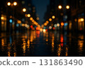 Bokeh of city lights at night reflected on rain-soaked road 131863490