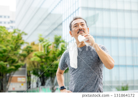 Senior men sweeping away 131864172