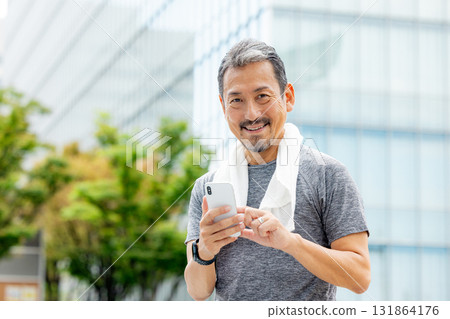 Senior man managing his health with an app 131864176