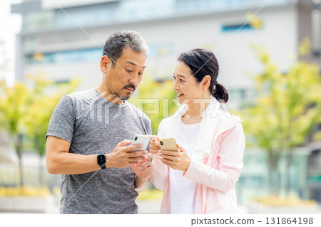 Senior couple watching a smartphone 131864198