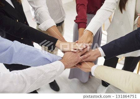 Hands of diverse business people giving high five close up, team members giving help unity Hands of diverse business people giving high five close up, team members giving help unity 131864751