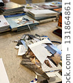 Collage making materials on table with magazines and cut-out papers for creative art project 131864861