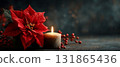 Red Poinsettia and Candle Christmas Decoration on Dark Background 131865436