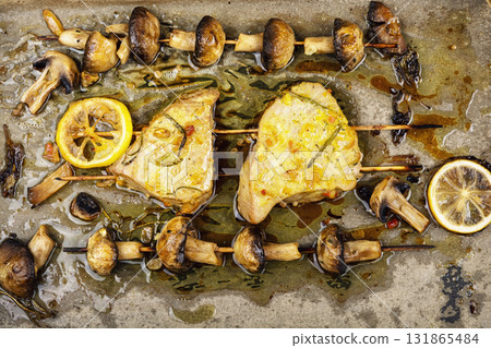 Two grilled tuna steak, kebabs. 131865484