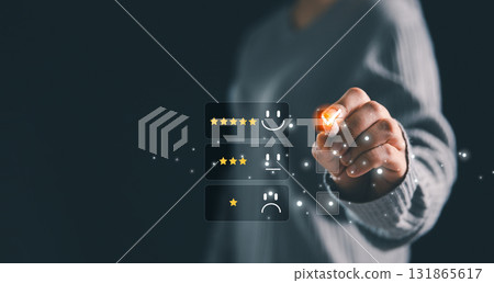 Business person selecting five-star rating with virtual interface, concept of online customer feedback, satisfaction survey, digital marketing, reputation management and service quality evaluation. 131865617