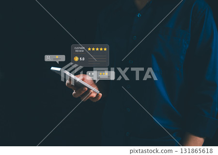 Businesswoman holding smartphone with floating customer review icons and star ratings, concept of online feedback, digital marketing, reputation management, customer satisfaction. satisfaction Businesswoman holding smartphone with floating customer review icons and star ratings, concept of online feedback, digital marketing, reputation management, customer satisfaction. satisfaction 131865618