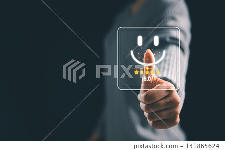 Business person touching virtual smiley face with five star rating, concept of positive customer feedback online review, satisfaction score, user experience and digital marketing service. satisfaction 131865624