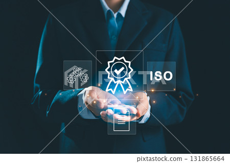 Person holding certificate icon represents concept of certification and standardization, business achieves ISO certified status quality assurance process in conformity with international standards. Person holding certificate icon represents concept of certification and standardization, business achieves ISO certified status quality assurance process in conformity with international standards. 131865664
