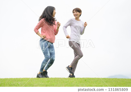 Two women running in the park Two women running in the park 131865809
