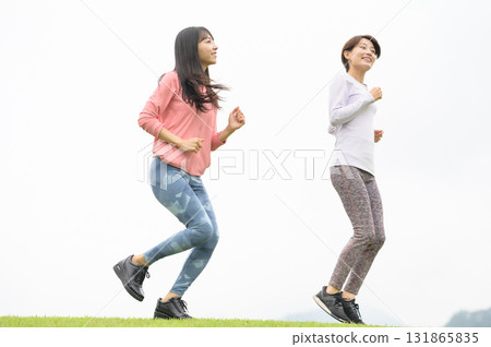 Two women running in the park Two women running in the park 131865835