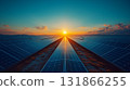 Solar panels stretching toward sunset horizon, renewable energy future concept 131866255