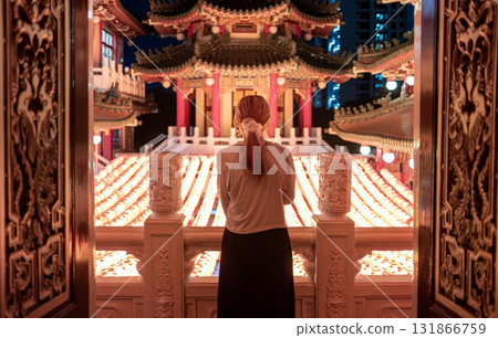 asian woman visit the chinese style temple with the hanging lanterns background in taiwan	 131866759