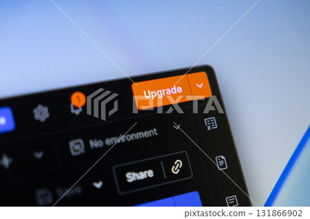Digital interface displayed on a screen features an Upgrade button, notification icon, and Share option, representing software improvements and premium service subscription opportunities 131866902