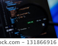 Dark screen displays programming code featuring a 200 OK status and response time, representing successful API execution and modern software engineering 131866916