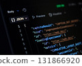 Close-up of a computer screen displaying structured JSON code and web performance metrics, highlighting its use in digital development and API response analysis 131866920