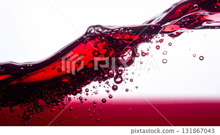 red wine splash in glass with splash 131867043