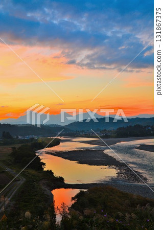 Echigo Sanzan and the confluence of the Shinano and Uono rivers at sunrise Echigo Sanzan and the confluence of the Shinano and Uono rivers at sunrise 131867375