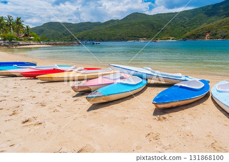 Kayaks on sandy beach by the sea in lagoon in summer on vacation on a sunny day 131868100