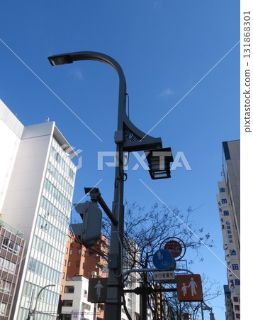 A skyscraper rising in the blue sky 131868301