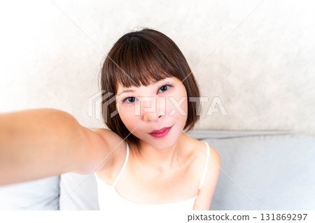 Young woman taking a selfie 131869297