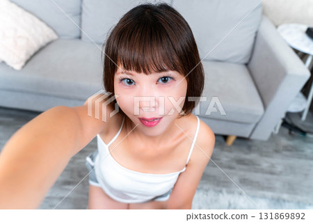 A young woman touching a smartphone 131869892
