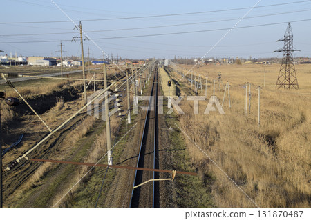 Plot railway. Top view on the rails. High-voltage power lines for electric trains 131870487