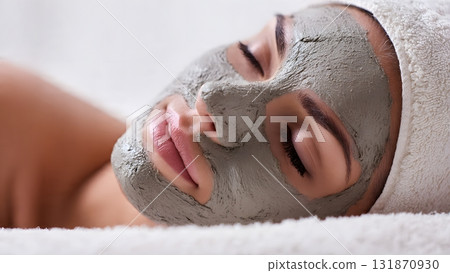 A young woman enjoys a detoxifying mud mask facial at a spa. This natural skincare treatment promotes health, wellness, and deeply cleanses pores for soft, smooth skin. AI Generated A young woman enjoys a detoxifying mud mask facial at a spa. This natural skincare treatment promotes health, wellness, and deeply cleanses pores for soft, smooth skin. AI Generated 131870930