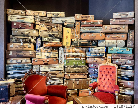 Retro suitcases and antique furniture 131871127