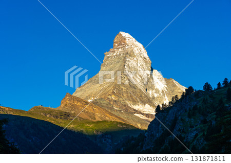 Scenic sunrise view of Matterhorn, one of the most famous and iconic Swiss mountains, Zermatt, Valais, Switzerland Scenic sunrise view of Matterhorn, one of the most famous and iconic Swiss mountains, Zermatt, Valais, Switzerland 131871811