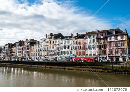 A streetscape of historic buildings along the river in Bayonne, in the heart of the French Basque Country 131872076