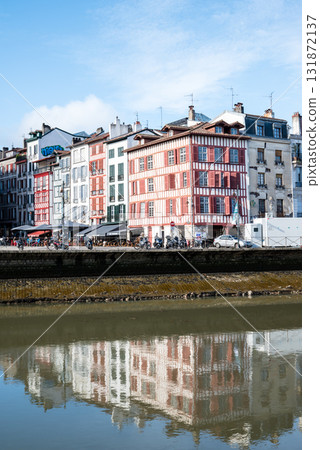 A streetscape of historic buildings along the river in Bayonne, in the heart of the French Basque Country 131872137