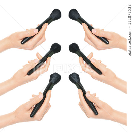 Set of hands holding cosmetic brushes isolated on transparent background Set of hands holding cosmetic brushes isolated on transparent background 131872538