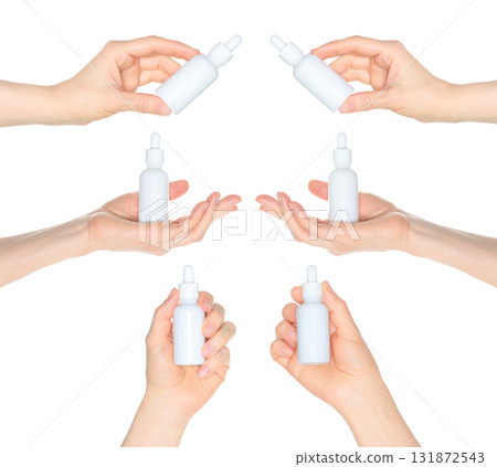 Set of human hands holding white cosmetic bottle isolated on transparent background Set of human hands holding white cosmetic bottle isolated on transparent background 131872543