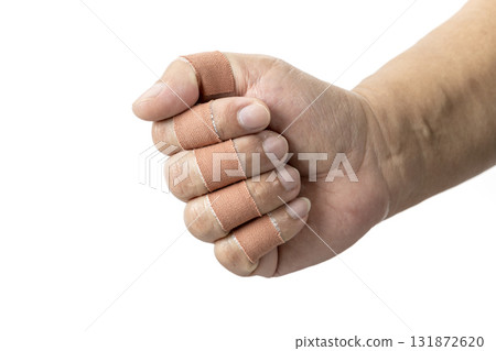 Hand with bandaged fingers is clenched into fist, showing protective covering on each finger. bandages are beige and background is plain white 131872620