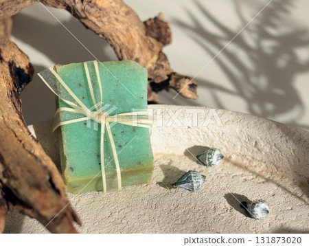 Cubes of natural soap against backdrop of natural elements. Handicrafts and hobbies. Cosmetics and beauty. Eco-friendly products. Background, composition for design. Cubes of natural soap against backdrop of natural elements. Handicrafts and hobbies. Cosmetics and beauty. Eco-friendly products. Background, composition for design. 131873020