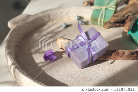 Cubes of natural soap against backdrop of natural elements. Handicrafts and hobbies. Cosmetics and beauty. Eco-friendly products. Background, composition for design. 131873021